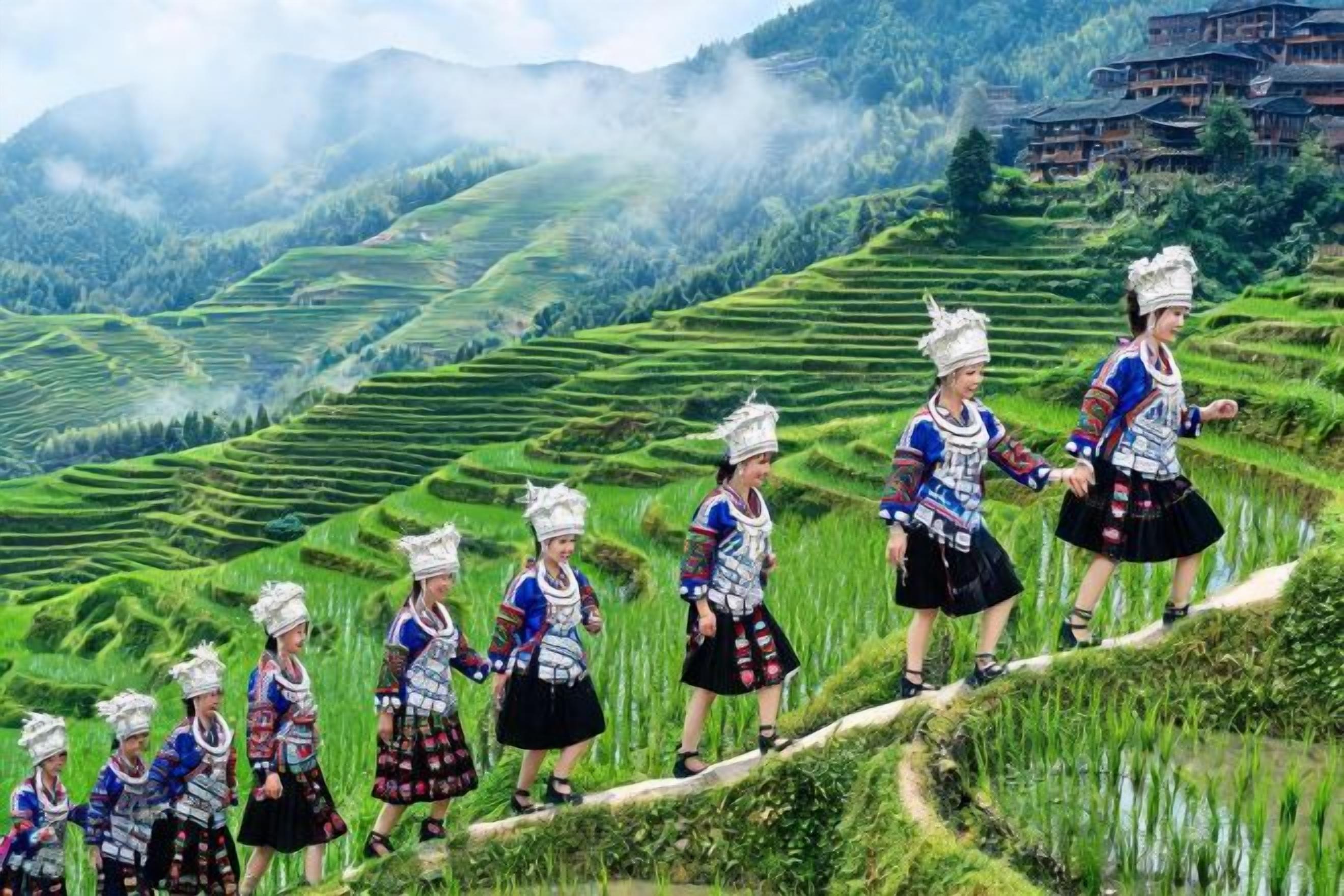 Terraced rice fields with people in traditional attire.