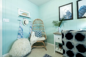 Cocoon chair offers additional seating with a tropical feel.