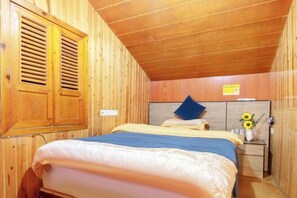 A wooden-paneled room with a bed, a nightstand, and a window with shutters. - Fenghuang Memory River View Inn - Near Ancient City & River View Balcony (Fenghuang County)