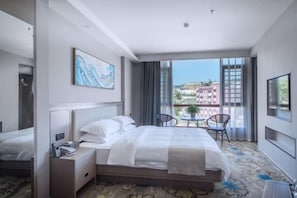 A hotel room with a bed, bedside table, and a view of the city. - 1700 Hotel (Pingle)