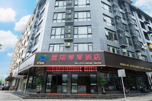 A hotel with a signboard displaying the name and contact information. - 1700 Hotel (Pingle)