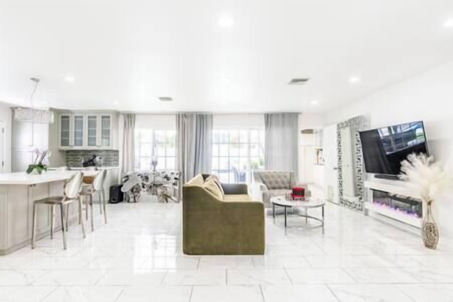 Spacious gathering room with an electric fireplace, SmartTV and Sound system (2)