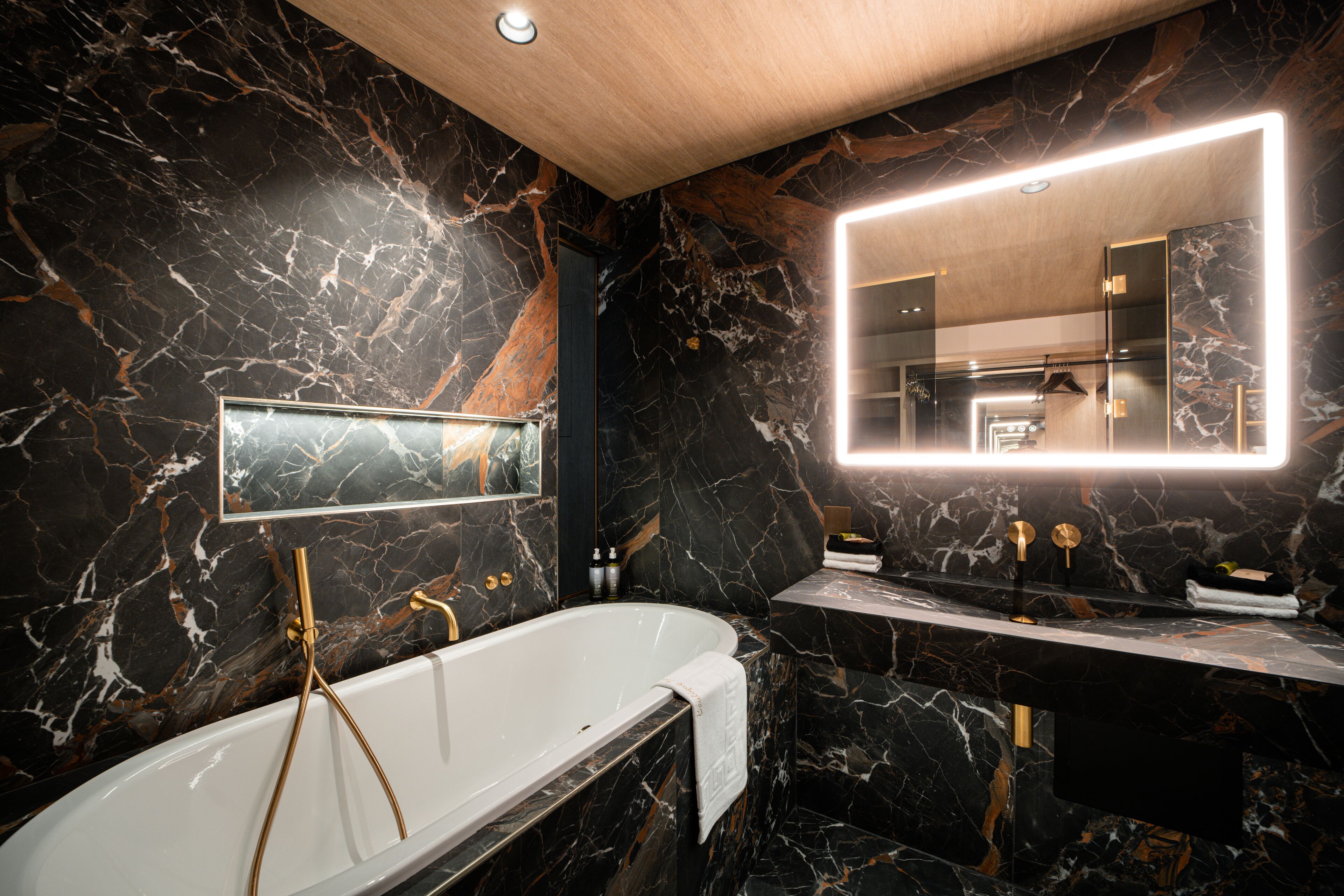 executive double room | bathroom | rainfall showerhead, free toiletries, hair dryer, bathrobes