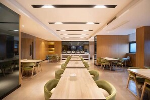 A modern conference room with long tables and green chairs, equipped with ceiling lights and a large window. - Miya Hotel (Chongqing Jieshi Xinke) (Chongqing)