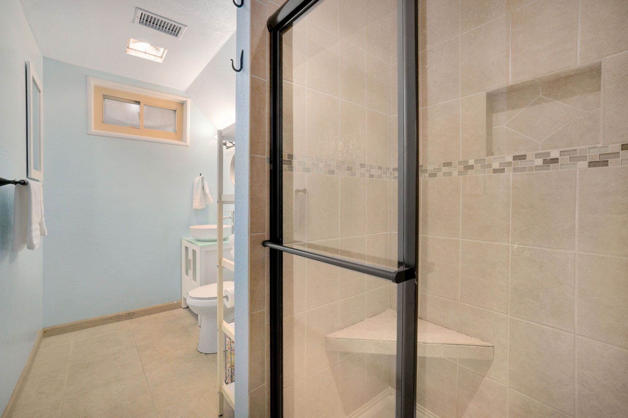 Shower, hair dryer, towels, toilet paper