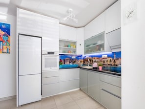 Apartment (Two Bedroom Apartment with Terrace) | Private kitchen | Fridge, dining tables