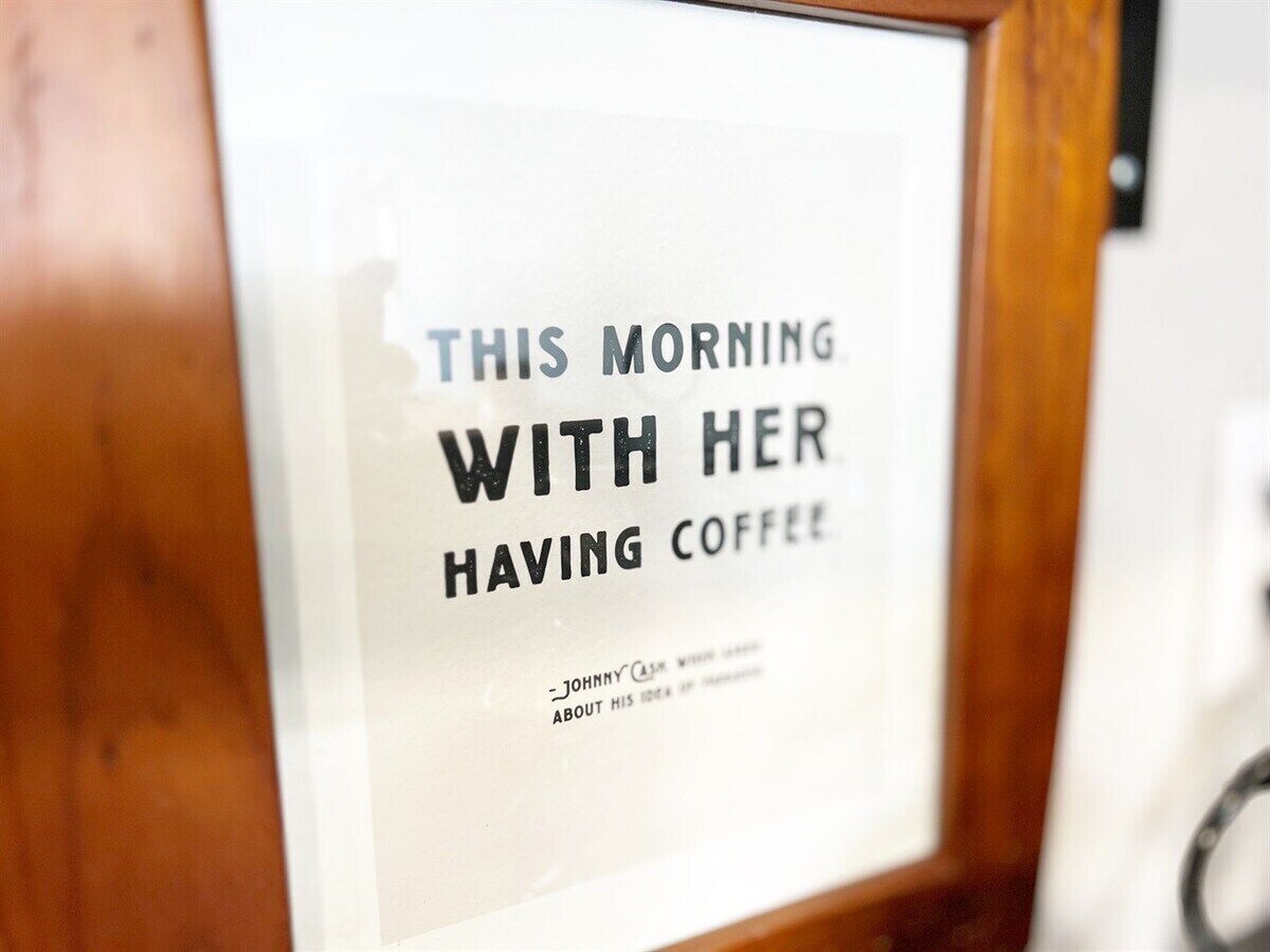 A framed sign with text.