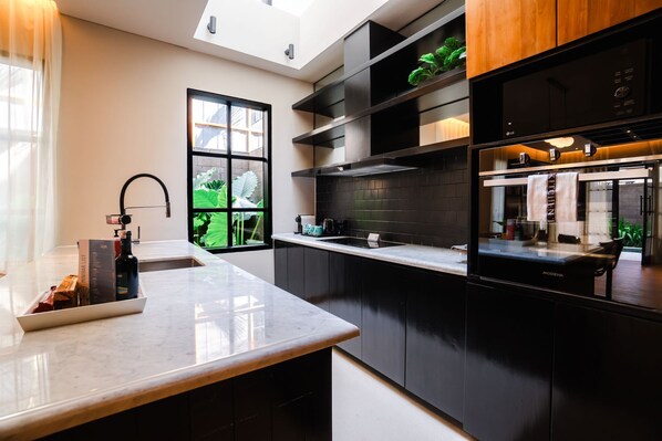 Fridge, stovetop, espresso maker, coffee/tea maker