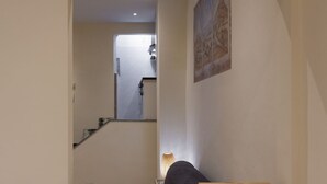 A hallway leading to a kitchen with a staircase. - Chianti's Inn Sangiovese (Firenze)