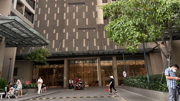 A high-rise building with a modern architectural design, featuring a patterned facade and multiple balconies. - Supertramp House - Gold View Apartment (Ho Chi Minh City)