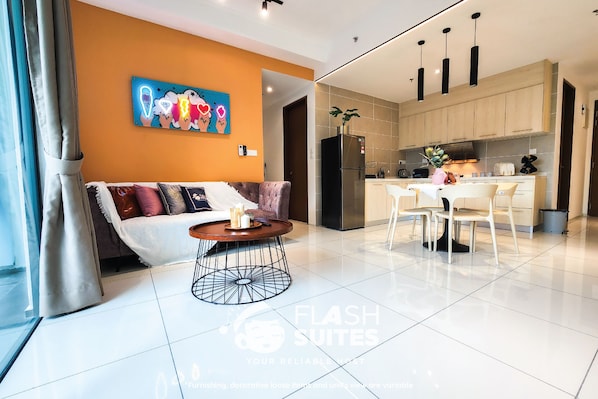 Deluxe Suite, 2 Bedrooms | Living area | 42-inch LED TV with cable channels, TV