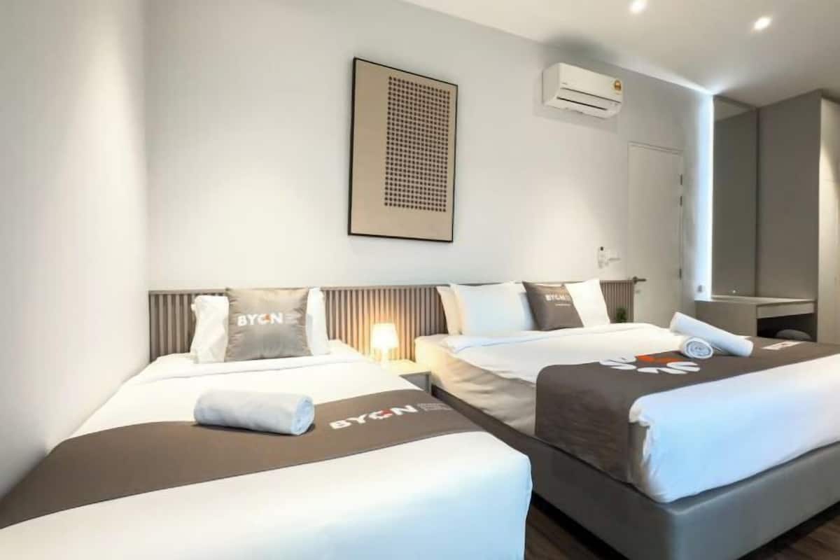 Laptop workspace, blackout curtains, iron/ironing board, bed sheets