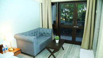 Premium Room | Living area | 40-inch Smart TV with digital channels, TV, Netflix