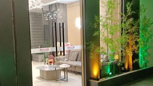 A modern interior with a sofa, coffee table, and decorative lighting. - an County Zhengxing Business Hotel (Mianyang)