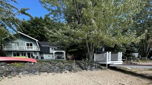 A house with a porch and a fenced yard.