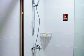 A shower with a glass enclosure, a towel rack, and a sign on the wall. - Jinying Shanzhuang Hotel (Hengshan County)