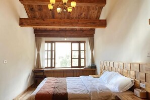 A bedroom with a wooden ceiling, a large window with curtains, a bed with white bedding, and a bedside table. - 1958 Huakai Boutique Hostel (Yongjia)