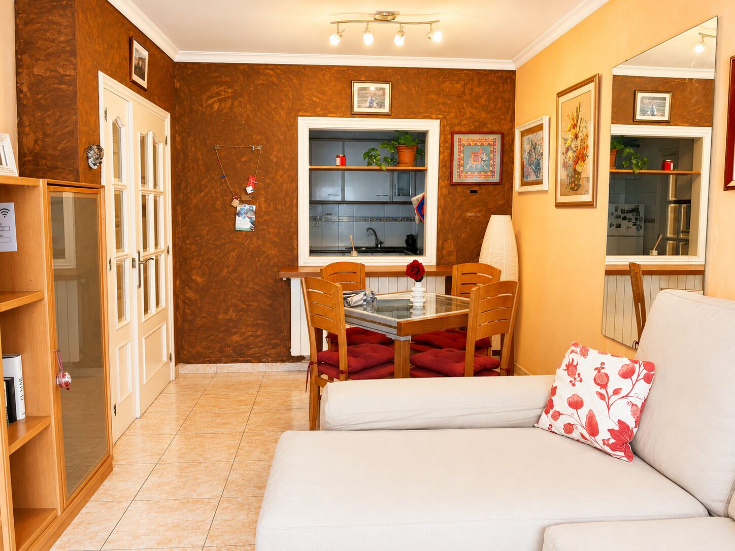 A compact living space with a kitchenette, a dining area, and a seating area.