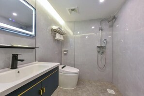 A modern bathroom with a vanity, toilet, and shower. - Chongqing Hotel (Shenzhen Luohu Port Guomao Subway Station) (Shenzhen)