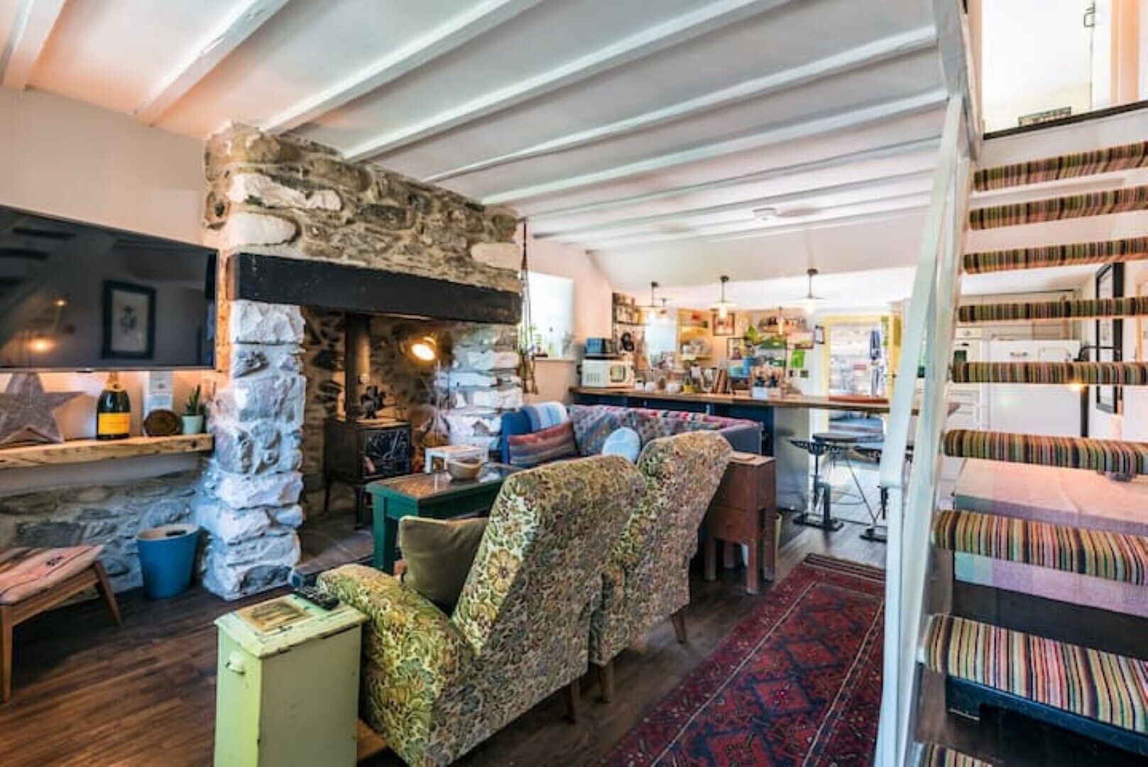 Smart TV, fireplace, books, printers