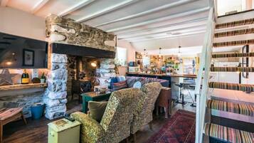Smart TV, fireplace, books, printers