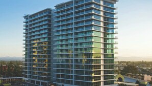 A multi-story hotel with a modern design, featuring balconies on each floor and a prominent 'WYNDHAM' sign at the top. - 2 Bedroom Ocean View Apartment - Q Stay (Surfers Paradise)