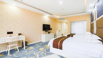 A hotel room with a bed, a desk, a chair, a TV, a mirror, and a window.