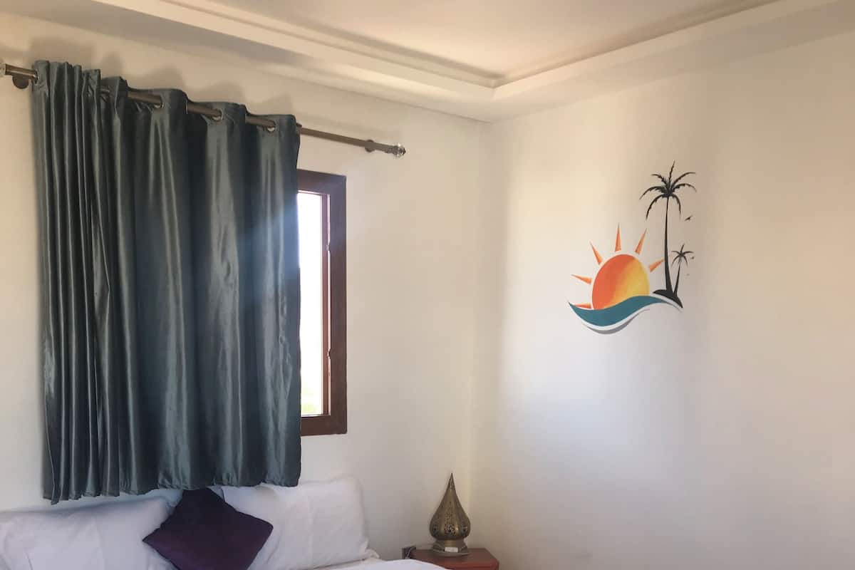 Economy Room, Pool View | Desk, WiFi (free), bed sheets