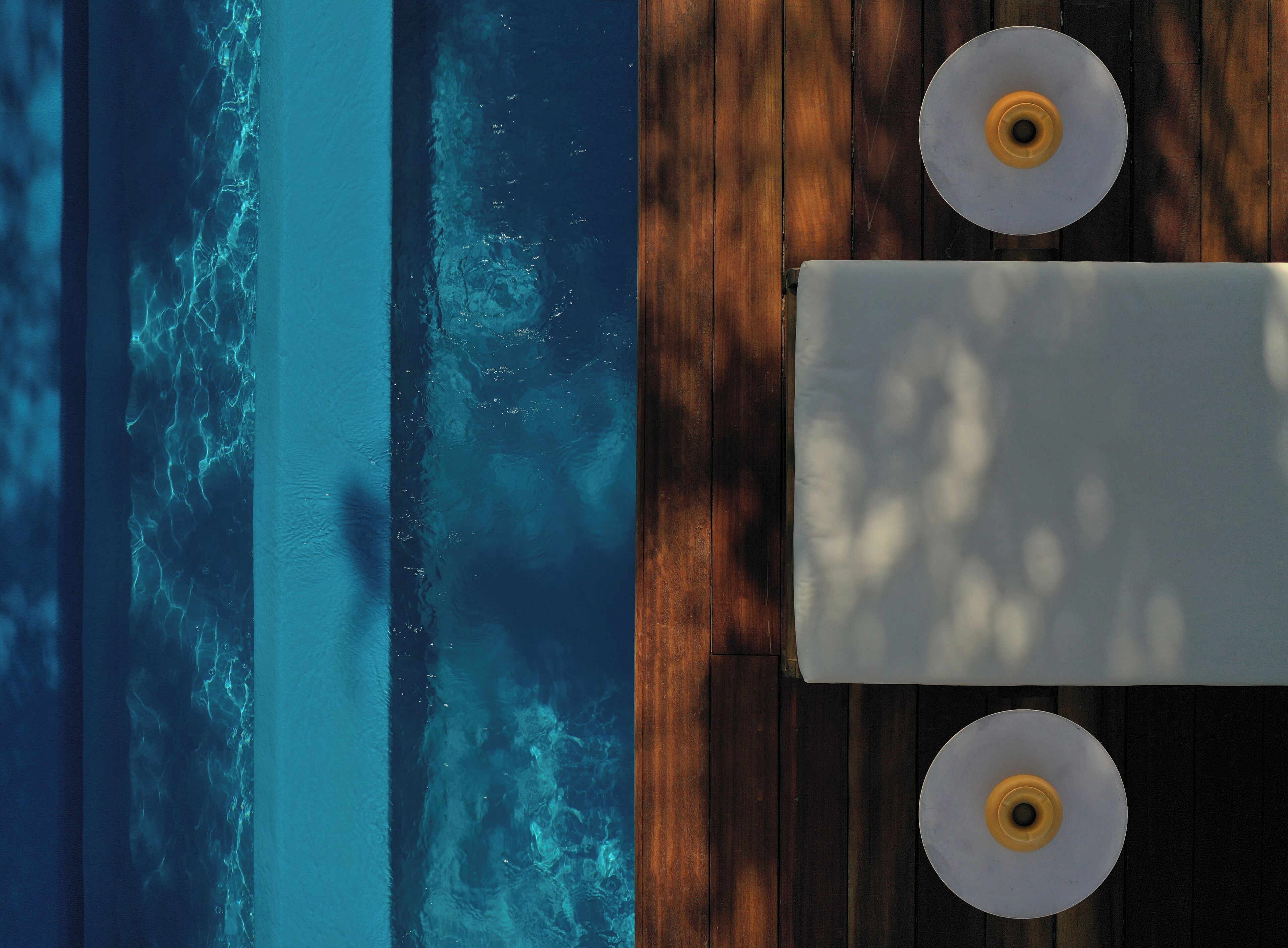 A wooden deck with a view of the ocean.