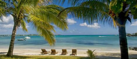 On the beach, sun loungers, beach towels