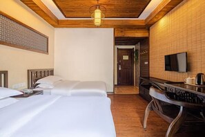A hotel room with two beds, a wooden ceiling, a television, and a small table with a kettle. - Zimu Villa (Zhangjiajie National Forest Park Zimugang Ticket Station) (Zhangjiajie)