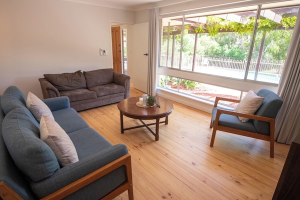 Dual Living Areas for Privacy and Versatility
Two distinct lounge areas across two levels – formal living downstairs and a family retreat upstairs – catering to various group dynamics.