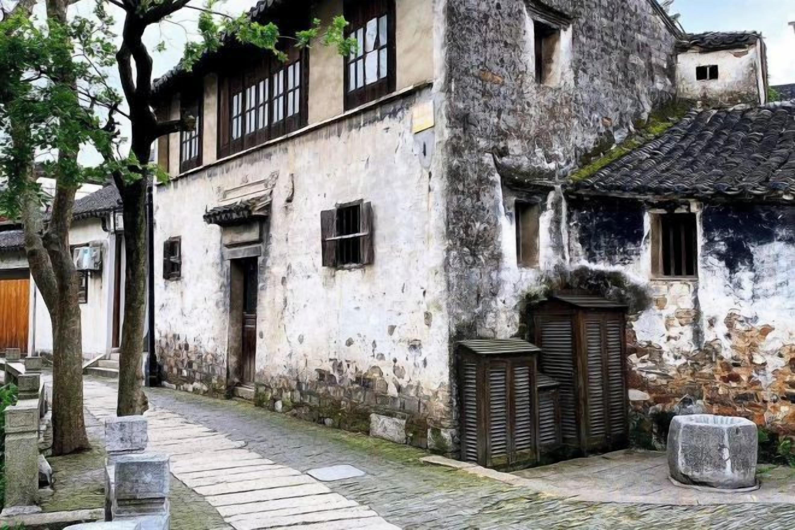 A traditional building with a stone pathway, wooden doors, and a tiled roof.