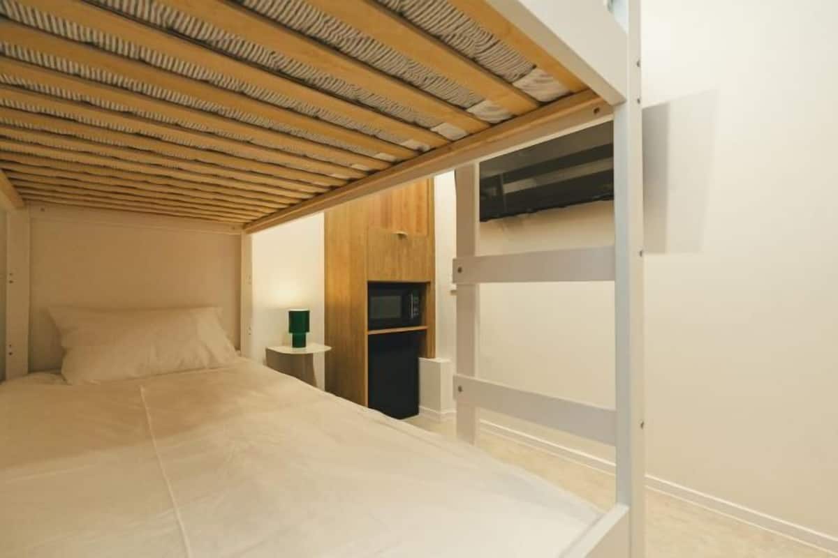 Desk, laptop workspace, free WiFi, bed sheets