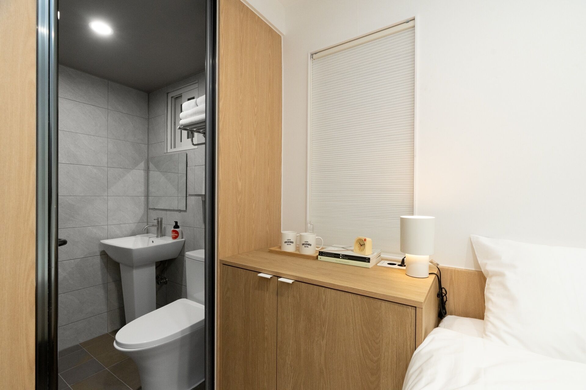 Shower, hair dryer, slippers, towels