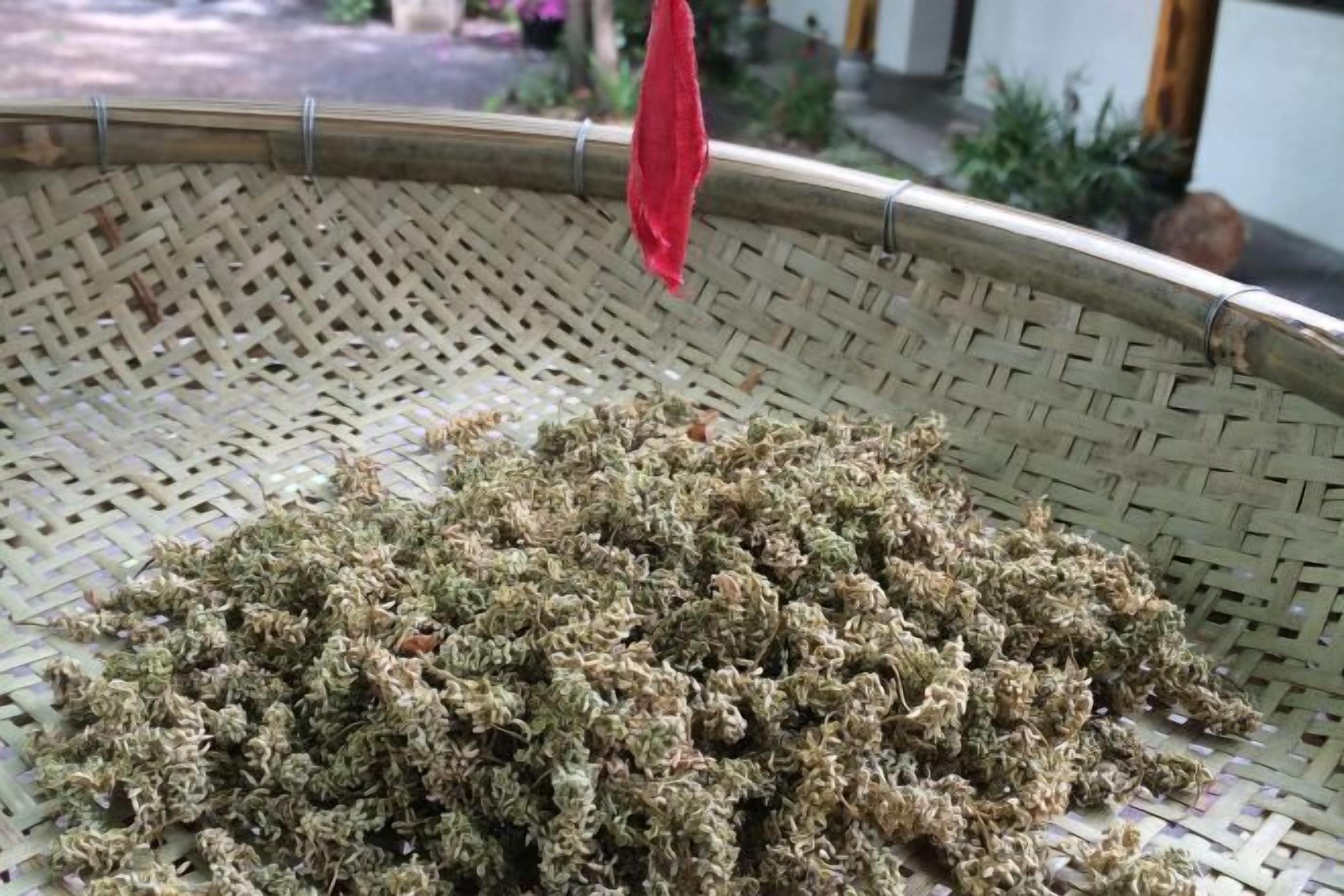 A woven basket filled with dried herbs.