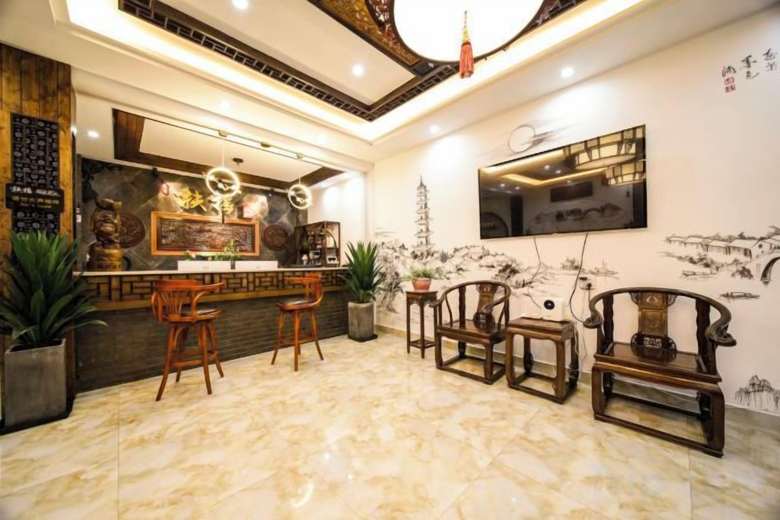 A modern interior with a bar area, seating, and decorative elements.