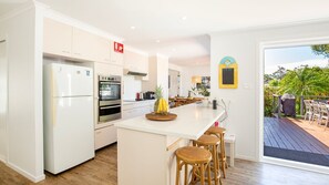 Fridge, dishwasher, coffee/tea maker, cookware/dishes/utensils