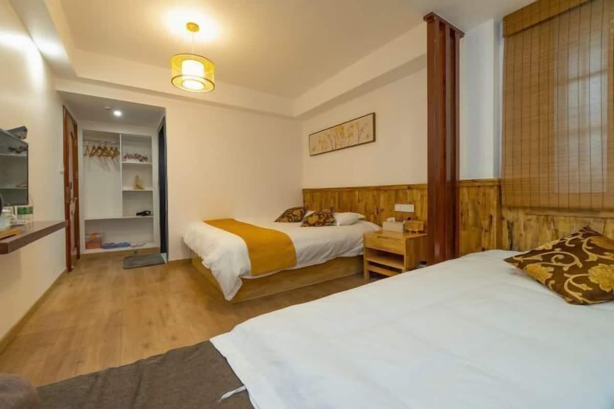 Cozy retreat with a single bed, nightstand, and wardrobe, perfect for a restful stay.