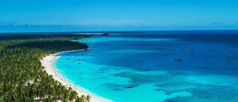 On the beach, sun-loungers, beach towels