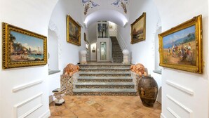 A grand staircase with ornate railings, leading to an upper floor. - Villa Artemisia in Piano di Sorrento (Piano di Sorrento)
