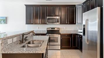 Condo, Multiple Beds, Balcony | Private kitchen | Fridge, microwave, oven, stovetop