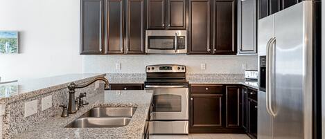 Condo, Multiple Beds, Balcony | Private kitchen | Fridge, microwave, oven, stovetop