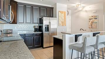 Condo, Multiple Beds, Balcony | Private kitchen | Fridge, microwave, oven, stovetop