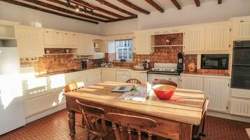 Fridge, electric kettle, cookware/dishes/utensils