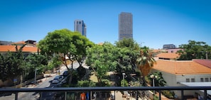 Stunning views of the city skyline from a peaceful neighborhood setting.