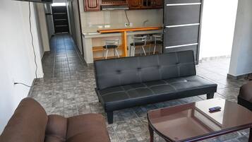 Family Room, Ensuite, Tower | Living area | 32-inch Smart TV with digital channels, TV, heated floors