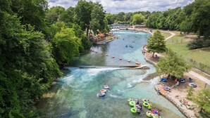 A river with clear water, surrounded by lush greenery and trees. - Ot 3515j Texas Yurt Haus: Javelina 1 Bedroom Cabin by RedAwning (New Braunfels)
