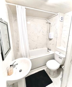 Hair dryer, towels, soap, shampoo