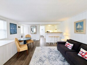 Cozy living space with a kitchenette, dining area, and comfortable seating.
